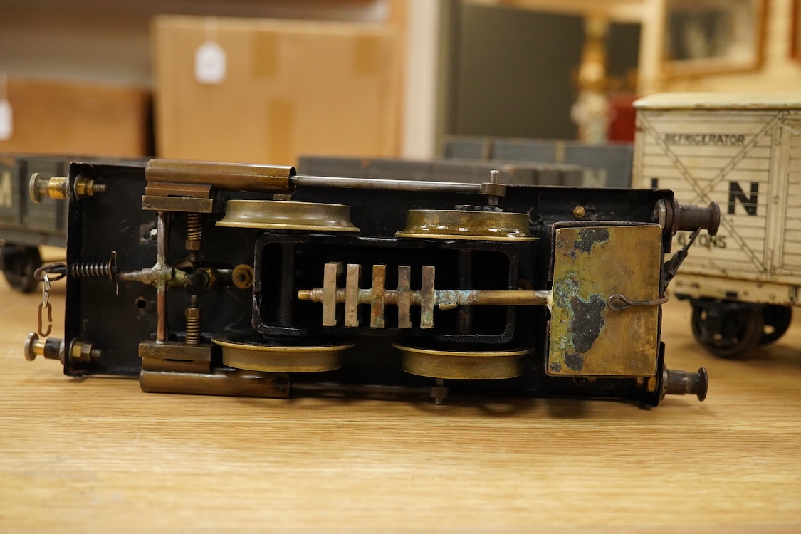 A Gauge One live steam 0-4-0T locomotive in the style of a Bowman model locomotive, with spirit fired with two simple outside oscillating cylinders, together with five LNWR and Midland Railway freight wagons, including a